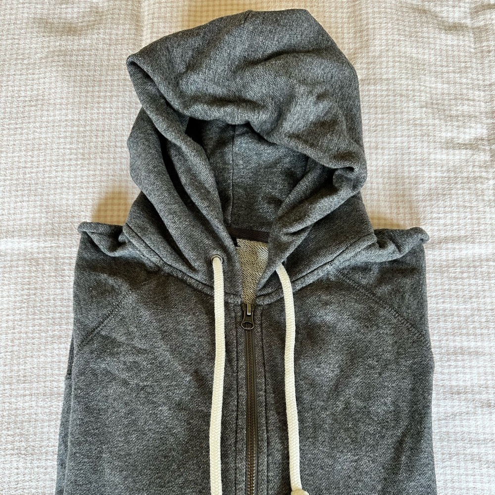 Grey MUJI Zip-Up with white drawstrings in size Medium